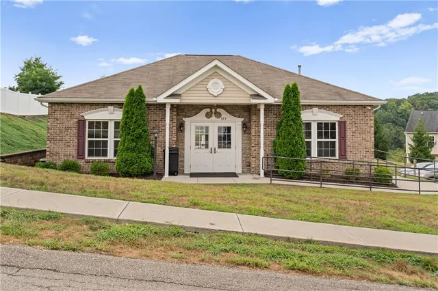 a front view of a house with a yard