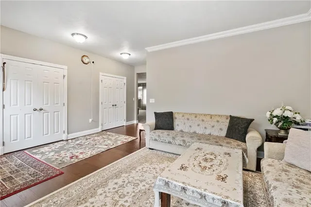 a living room with furniture and a rug