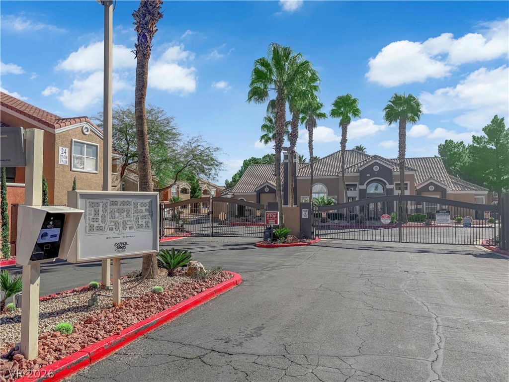 8101 West Flamingo Road, Unit 2030 Las Vegas, NV 89147 - Photo 12 of 27 Secure community entrance with an inviting gated entry.