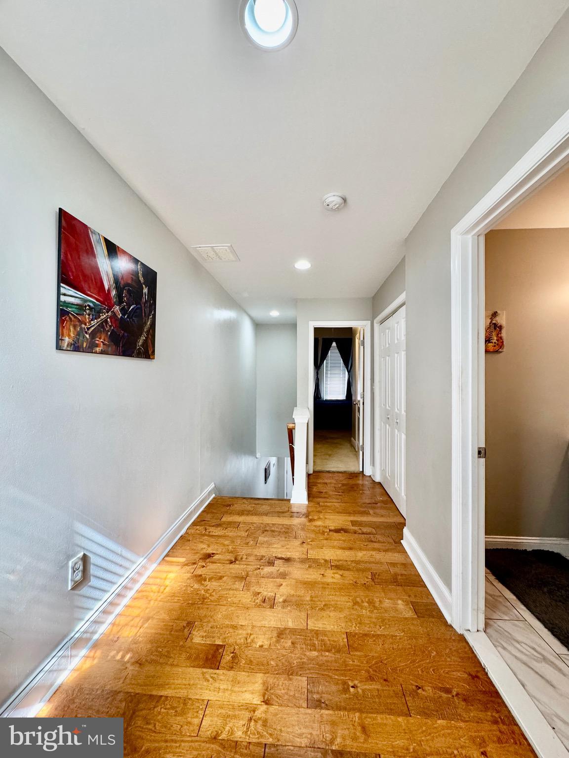 1019 West Fayette Street Baltimore, MD 21223 - Photo 15 of 29 a big room with wooden floor and bathroom