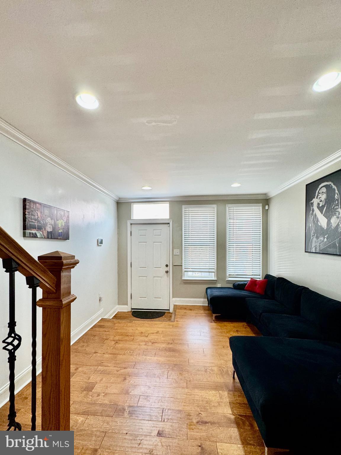 1019 West Fayette Street Baltimore, MD 21223 - Photo 2 of 29 a living room with furniture and a window