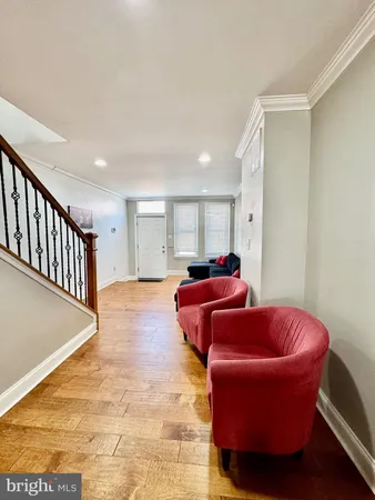a living room with furniture and a rug