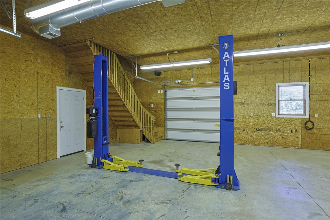 3681 Wilmington Road Lebanon, OH 45036 - Photo 59 of 87 This spacious garage features a convenient car lift and a sturdy staircase.