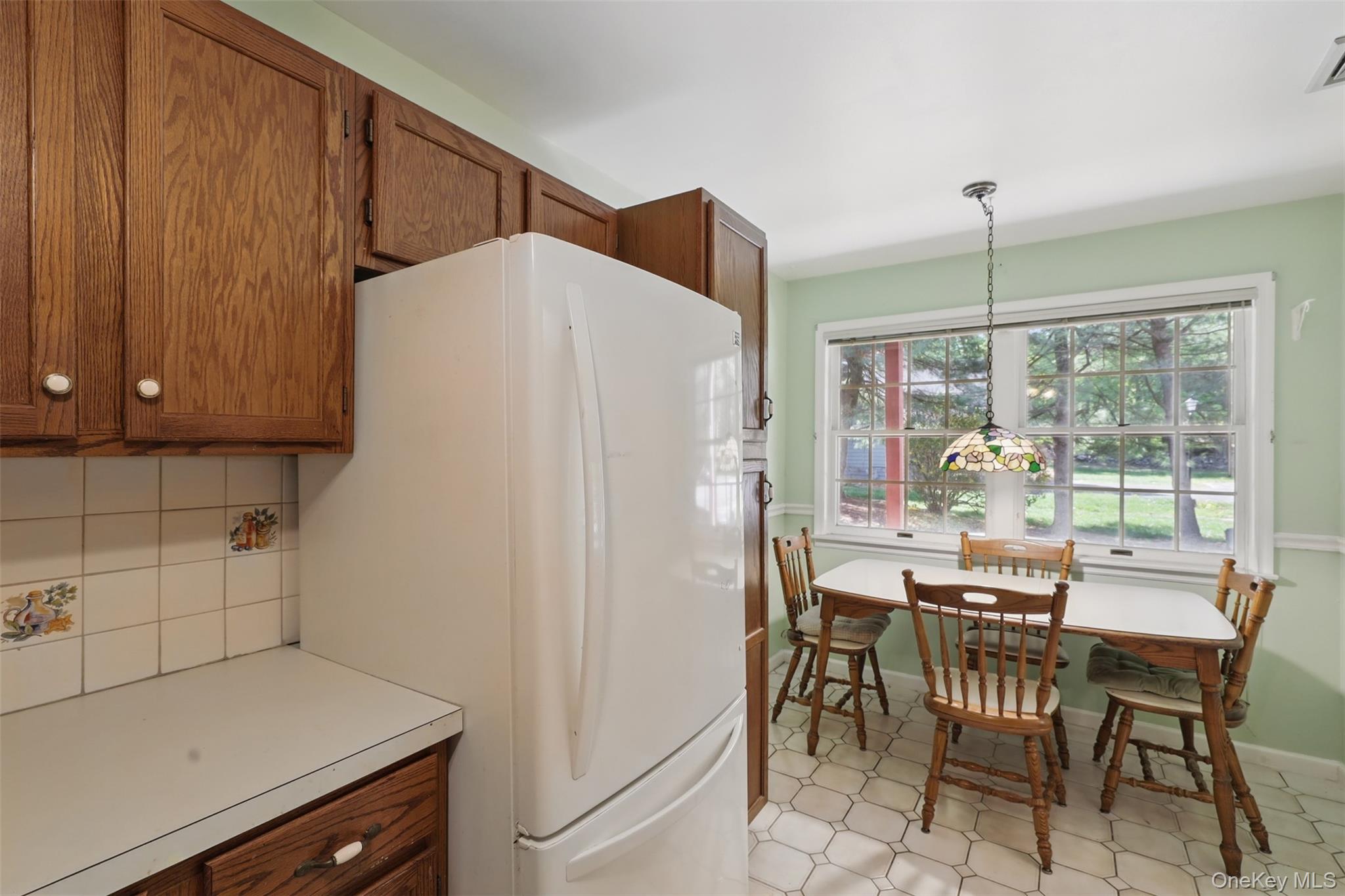 21 Lamplight Street Beacon, NY 12508 - Photo 12 of 26 a dining table chair next to a window