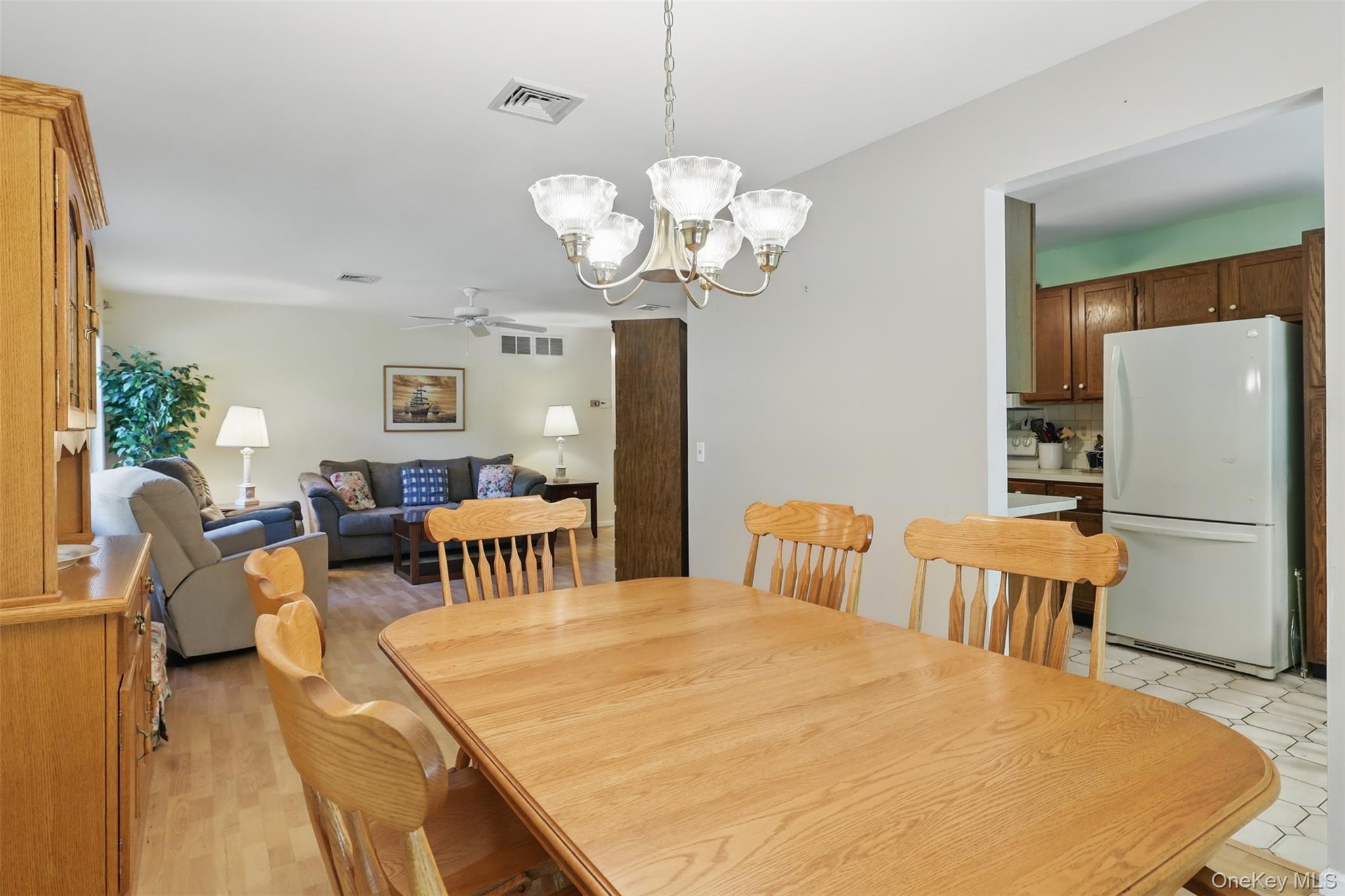 21 Lamplight Street Beacon, NY 12508 - Photo 13 of 26 a very nice looking dining room with a table chairs and chandelier