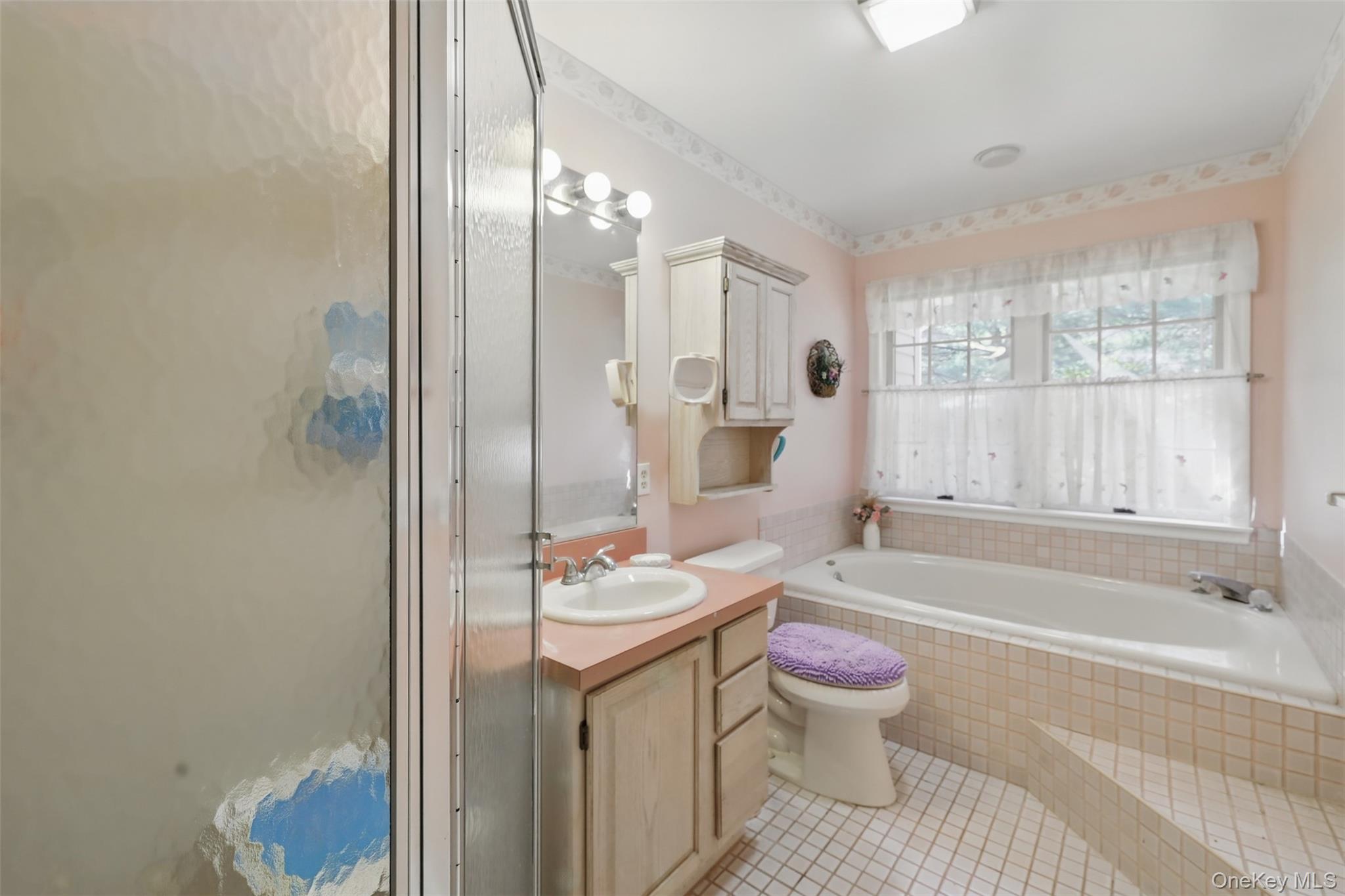 21 Lamplight Street Beacon, NY 12508 - Photo 16 of 26 a bathroom with a sink toilet tub and shower