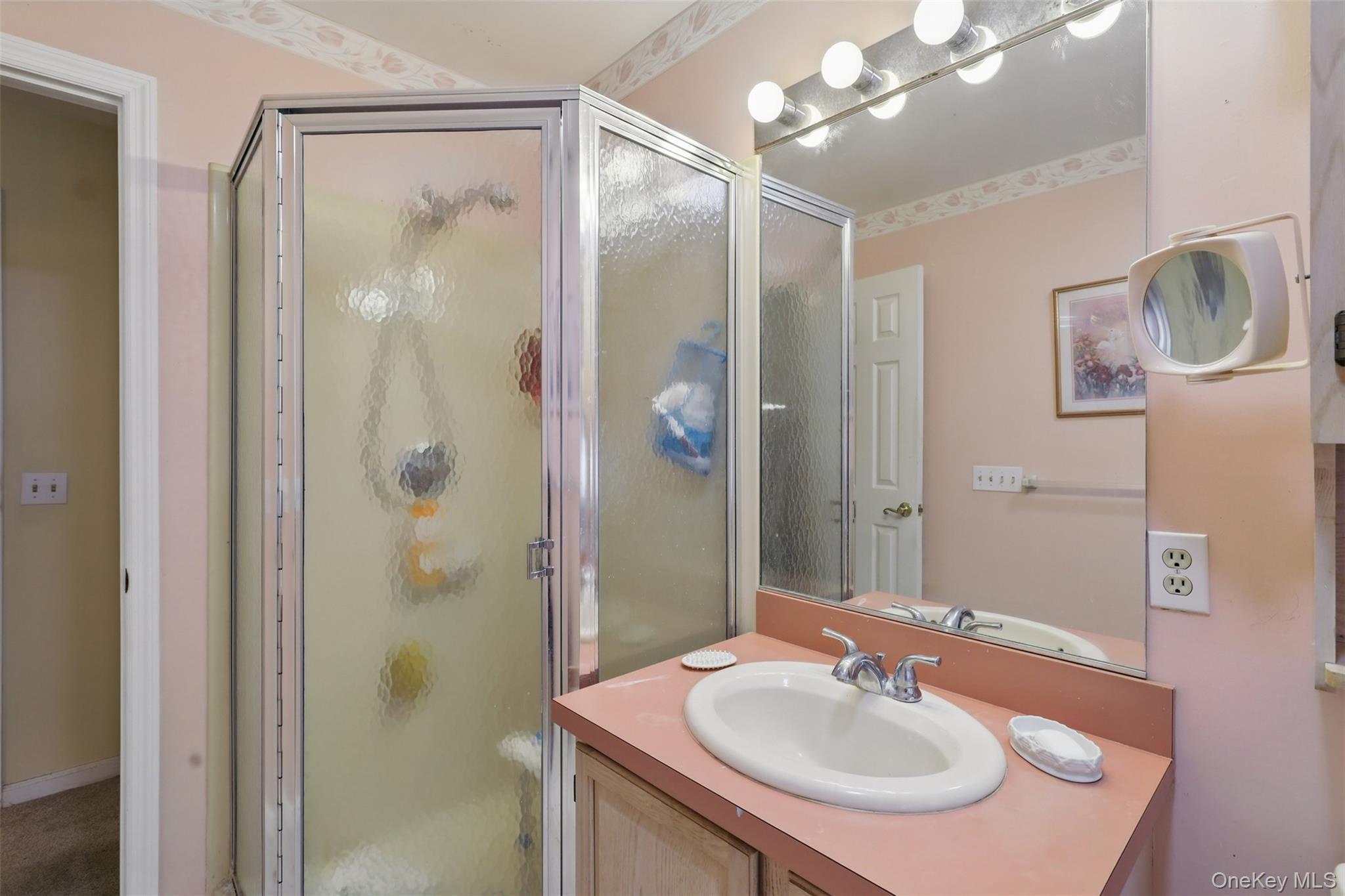 21 Lamplight Street Beacon, NY 12508 - Photo 17 of 26 a bathroom with a sink shower and a mirror