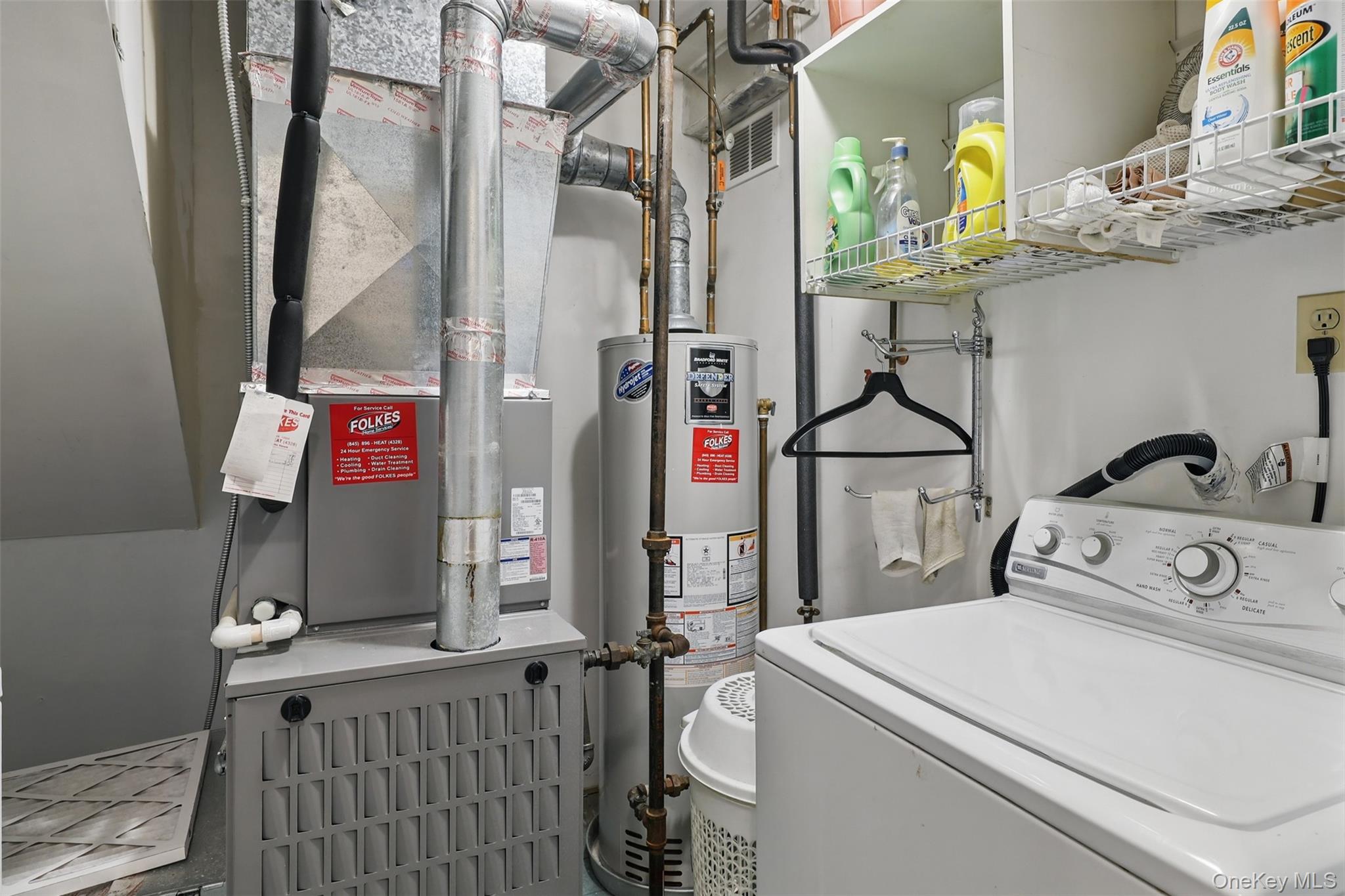 21 Lamplight Street Beacon, NY 12508 - Photo 20 of 26 a utility room with dryer washer and a mirror