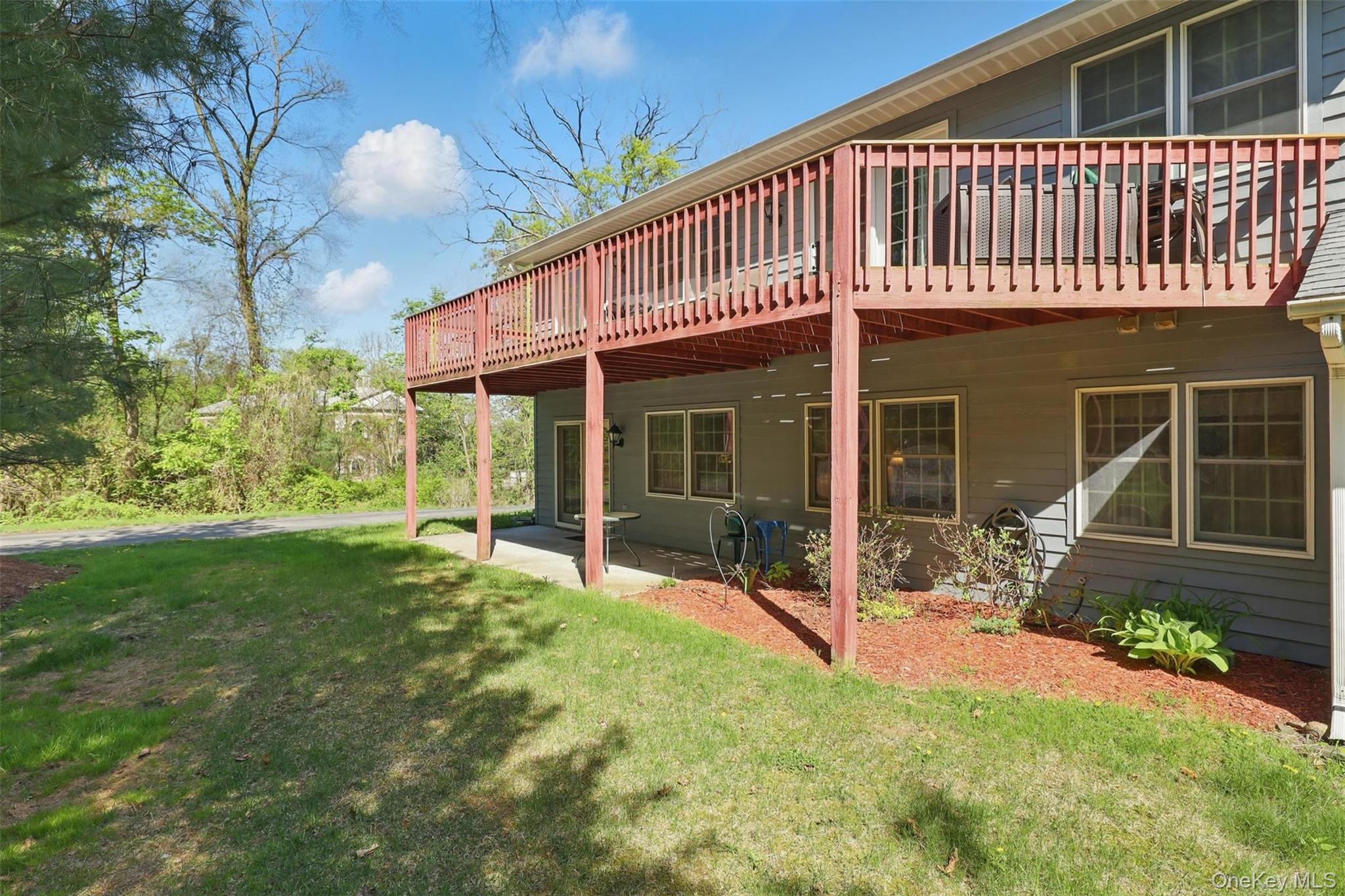 21 Lamplight Street Beacon, NY 12508 - Photo 21 of 26 a view of a house with backyard porch and sitting area