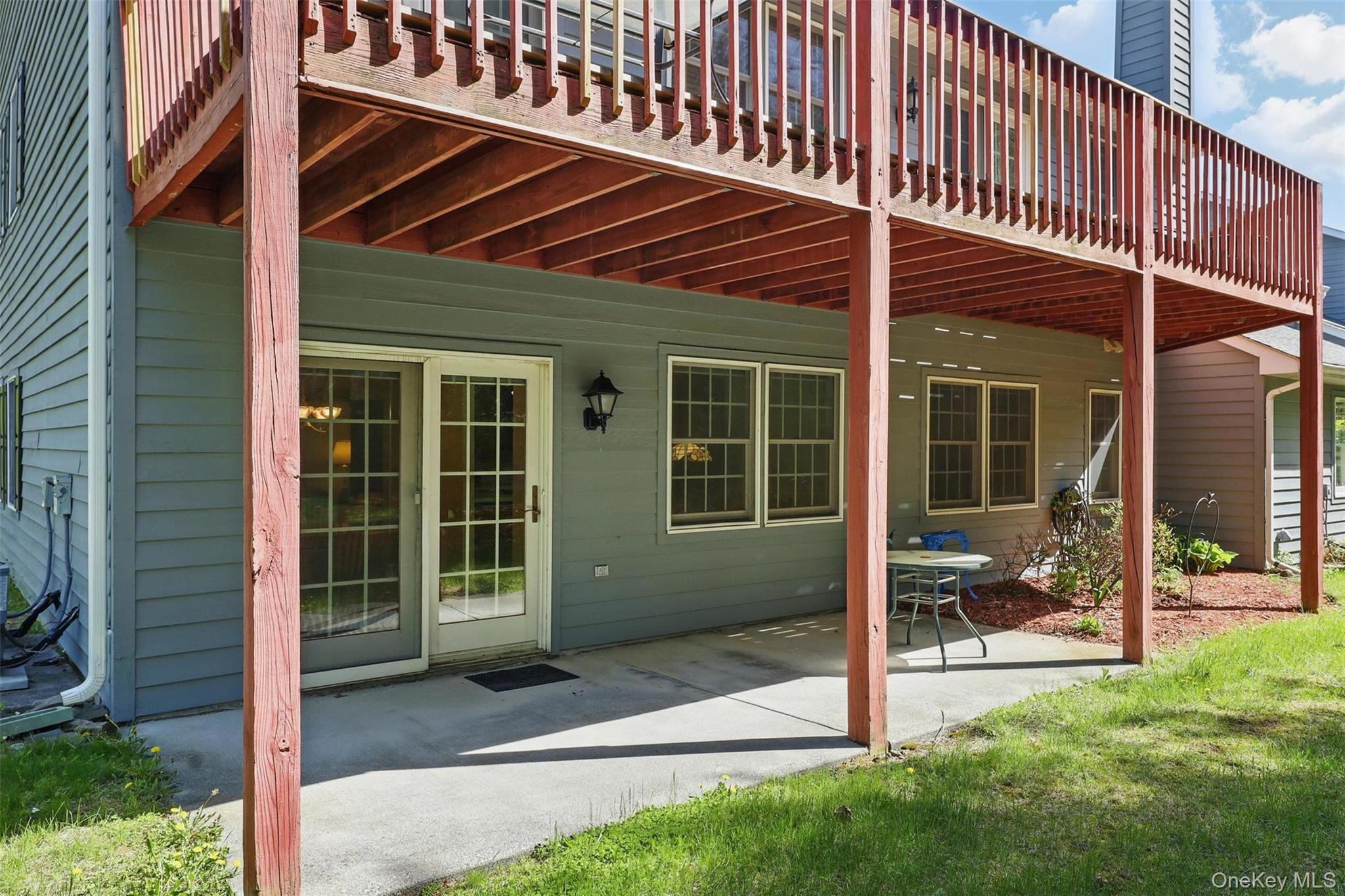 21 Lamplight Street Beacon, NY 12508 - Photo 23 of 26 a front view of a house with a large window and a yard