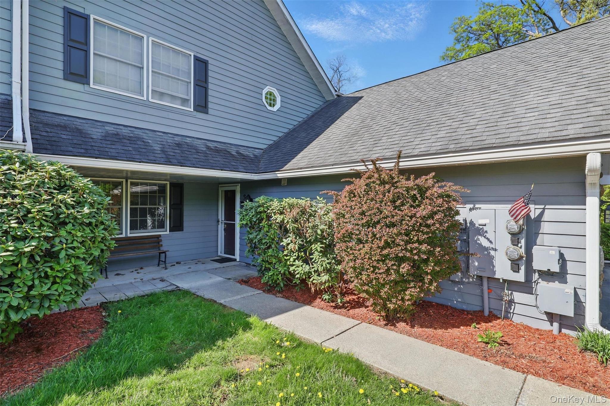21 Lamplight Street Beacon, NY 12508 - Photo 3 of 26 a front view of a house with garden