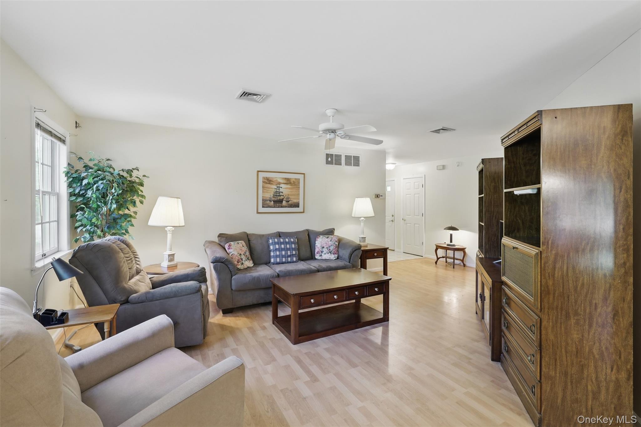 21 Lamplight Street Beacon, NY 12508 - Photo 6 of 26 a living room with furniture and a flat screen tv