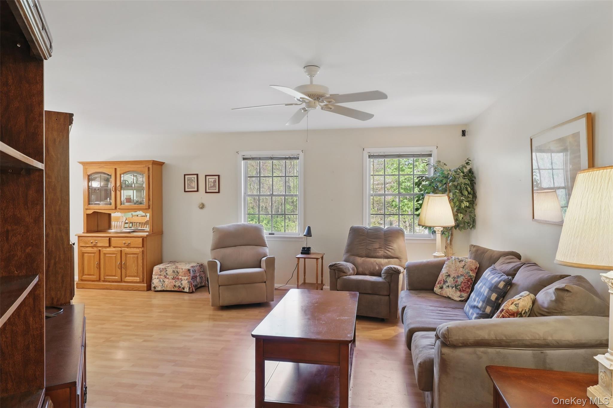 21 Lamplight Street Beacon, NY 12508 - Photo 7 of 26 a living room with furniture and a large window