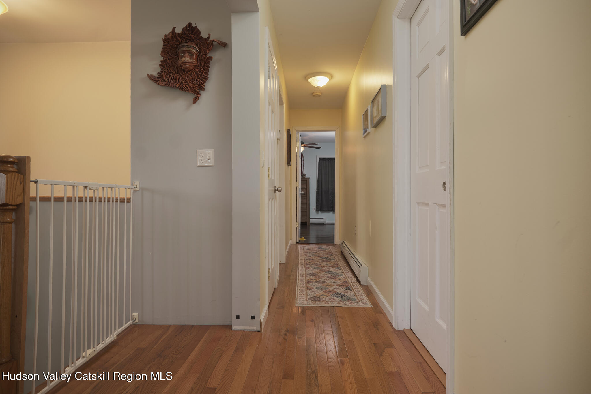 2226 County Rte 27 Hudson, NY 12534 - Photo 11 of 30 a view of a hallway with wooden floor and a bathroom