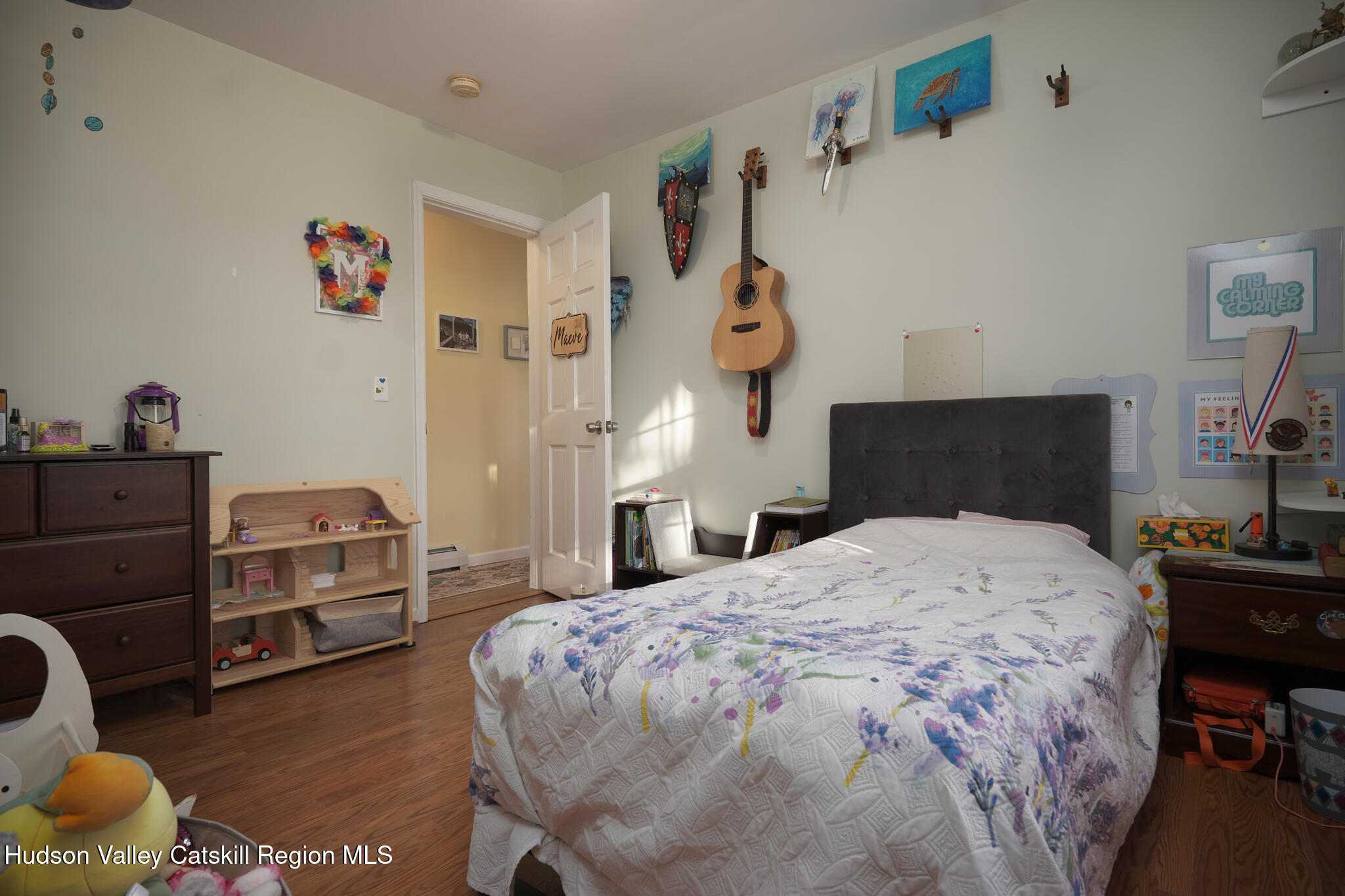 2226 County Rte 27 Hudson, NY 12534 - Photo 13 of 30 a bedroom with a bed and a chandelier