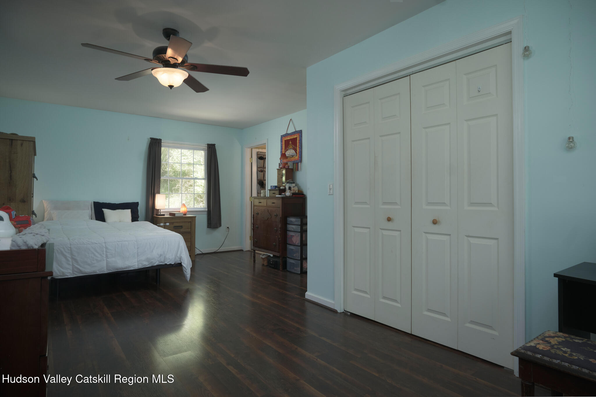 2226 County Rte 27 Hudson, NY 12534 - Photo 17 of 30 a bedroom with a bed and a chandelier