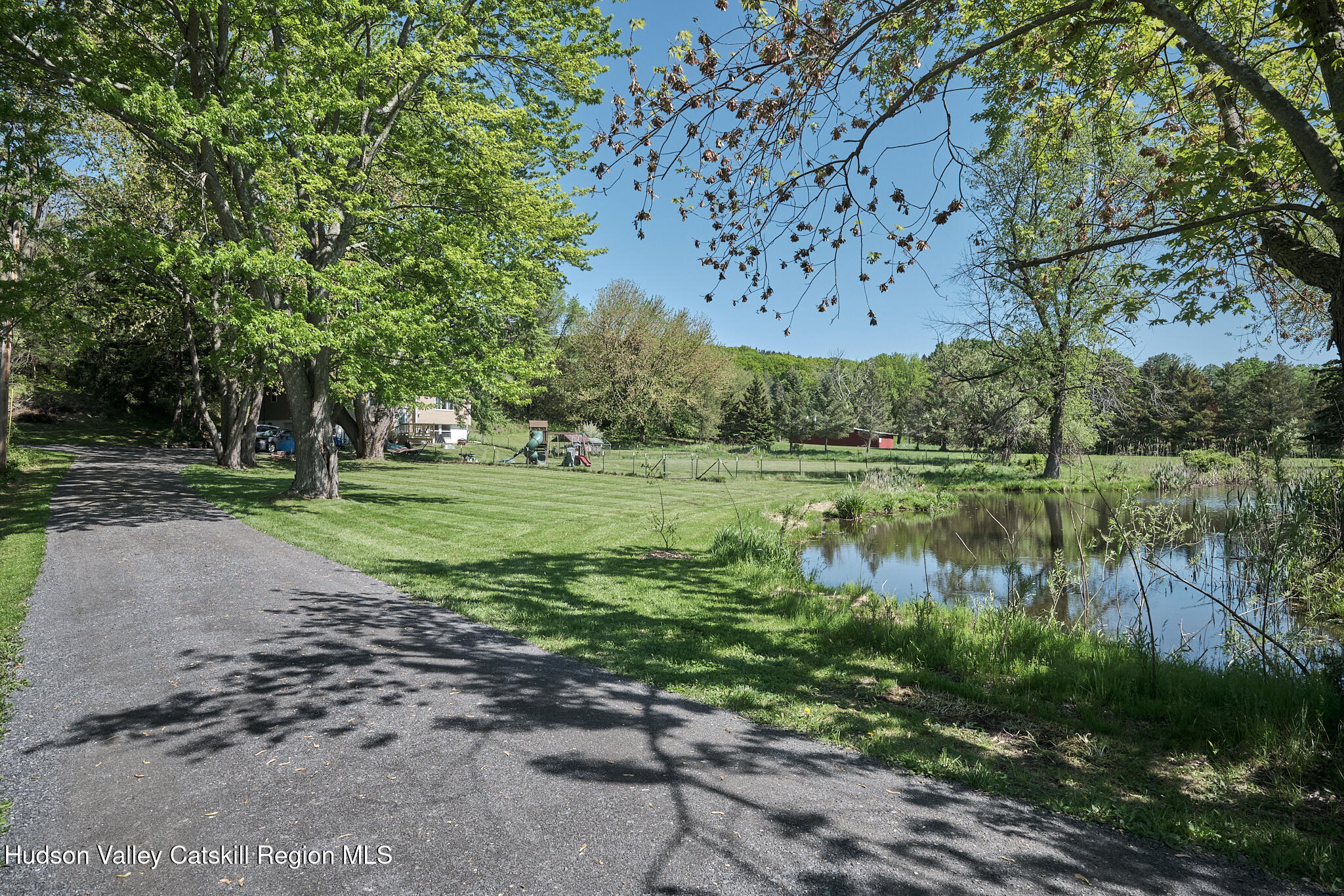 2226 County Rte 27 Hudson, NY 12534 - Photo 21 of 30 a view of a garden with a lake