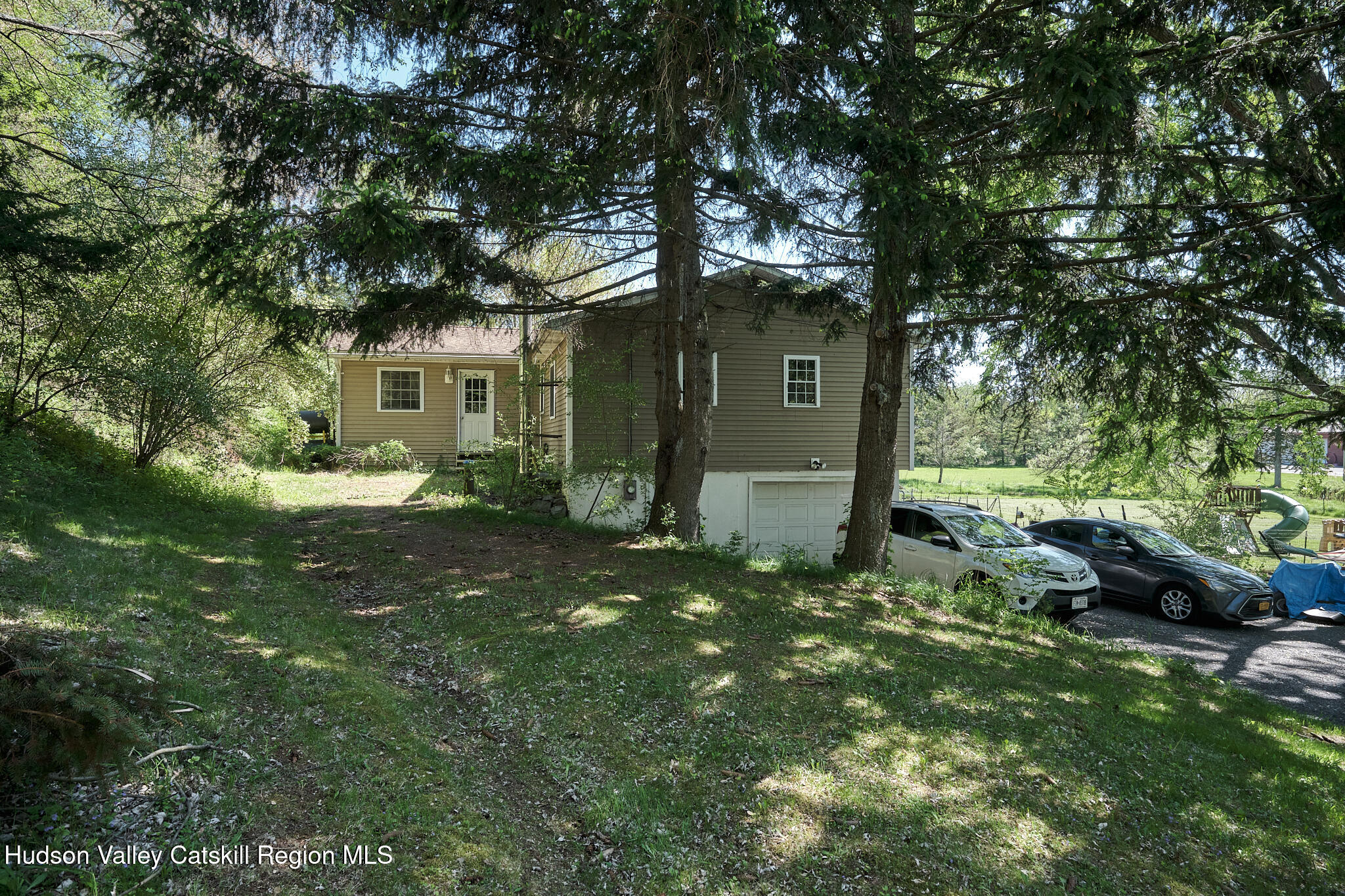 2226 County Rte 27 Hudson, NY 12534 - Photo 24 of 30 a backyard of a house with table and chairs