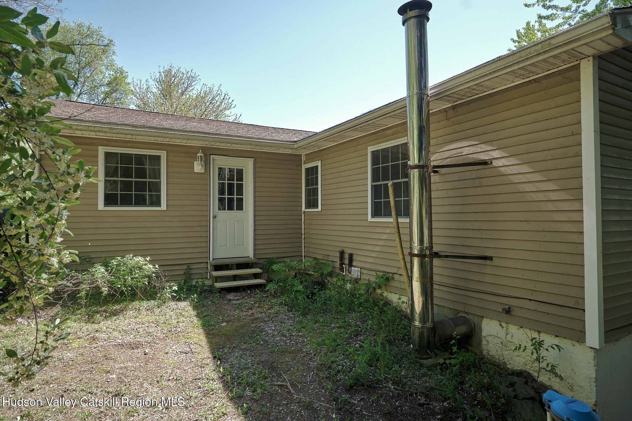 2226 County Rte 27 Hudson, NY 12534 - Photo 25 of 30 a front view of a house with a garden
