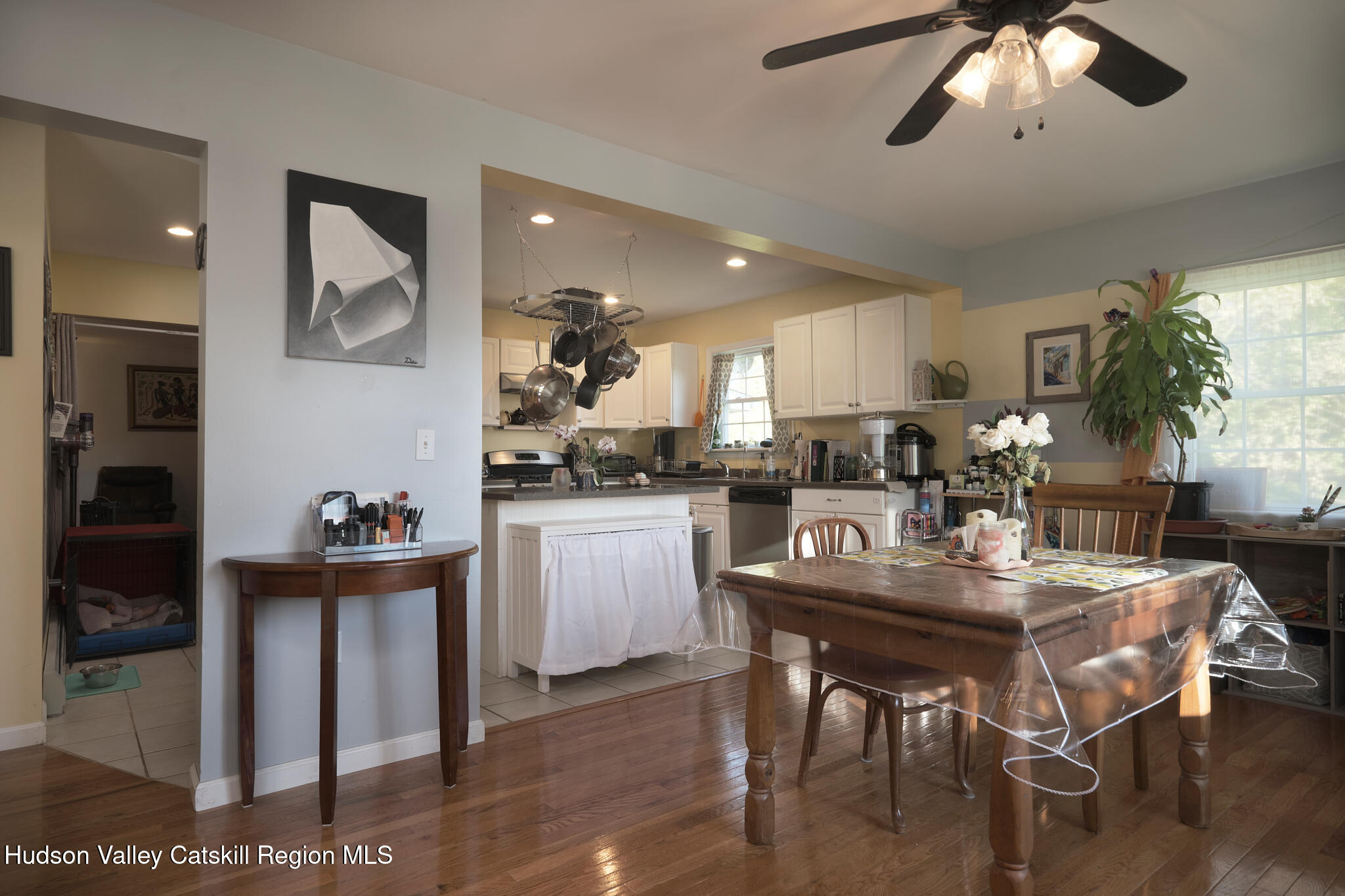 2226 County Rte 27 Hudson, NY 12534 - Photo 4 of 30 a kitchen with a dining table chairs and refrigerator