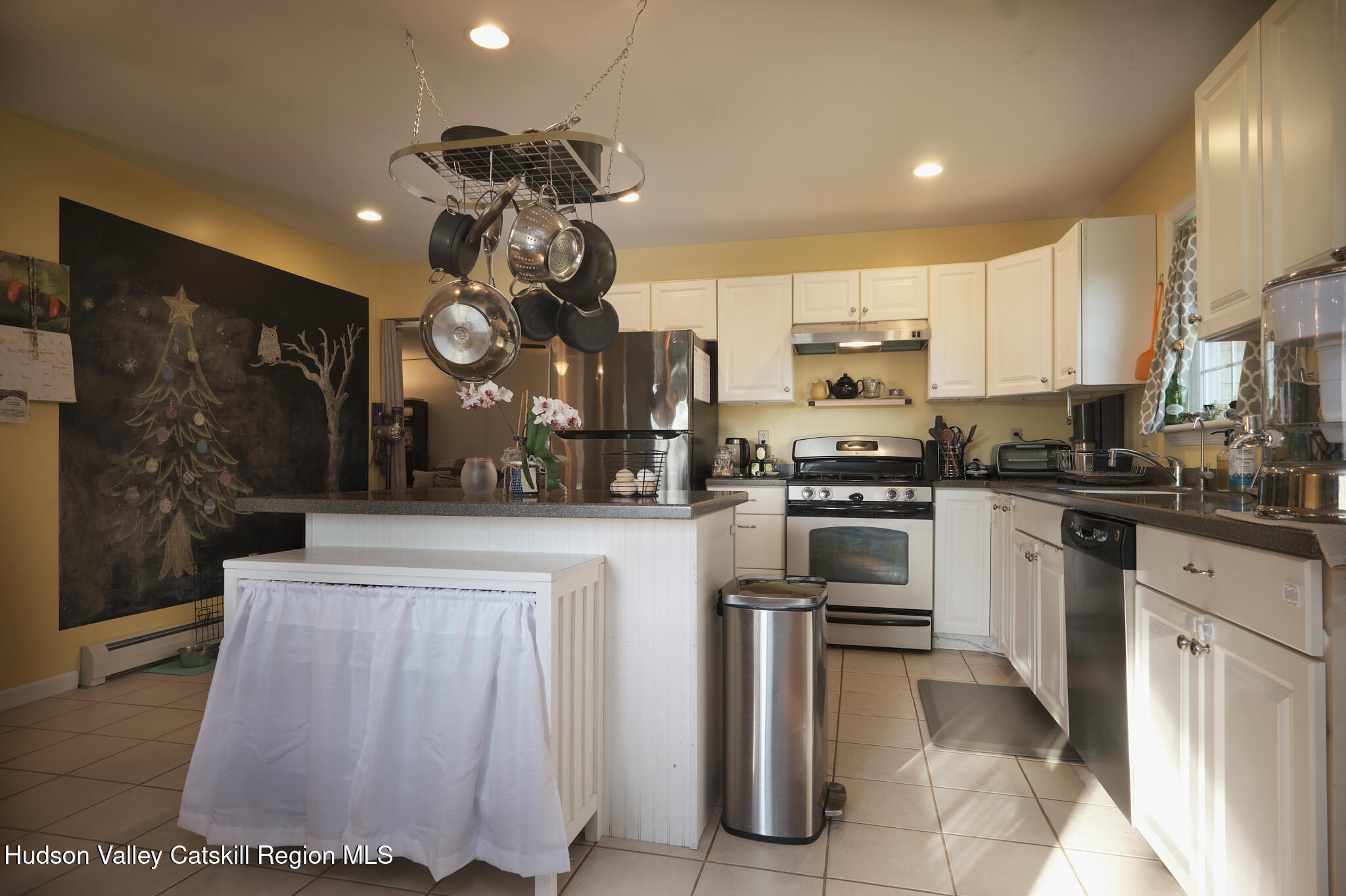2226 County Rte 27 Hudson, NY 12534 - Photo 5 of 30 a kitchen with white cabinets and stainless steel appliances