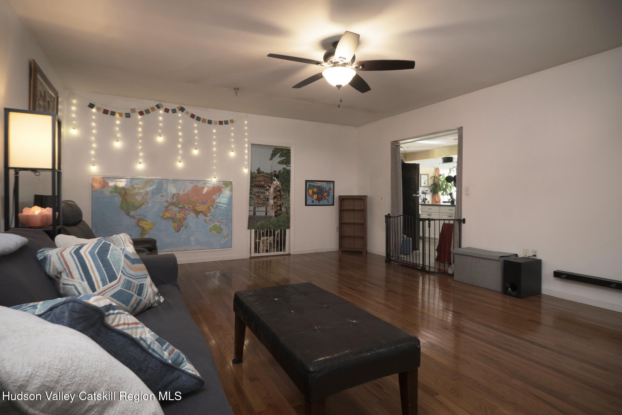 2226 County Rte 27 Hudson, NY 12534 - Photo 7 of 30 a living room with furniture and a chandelier