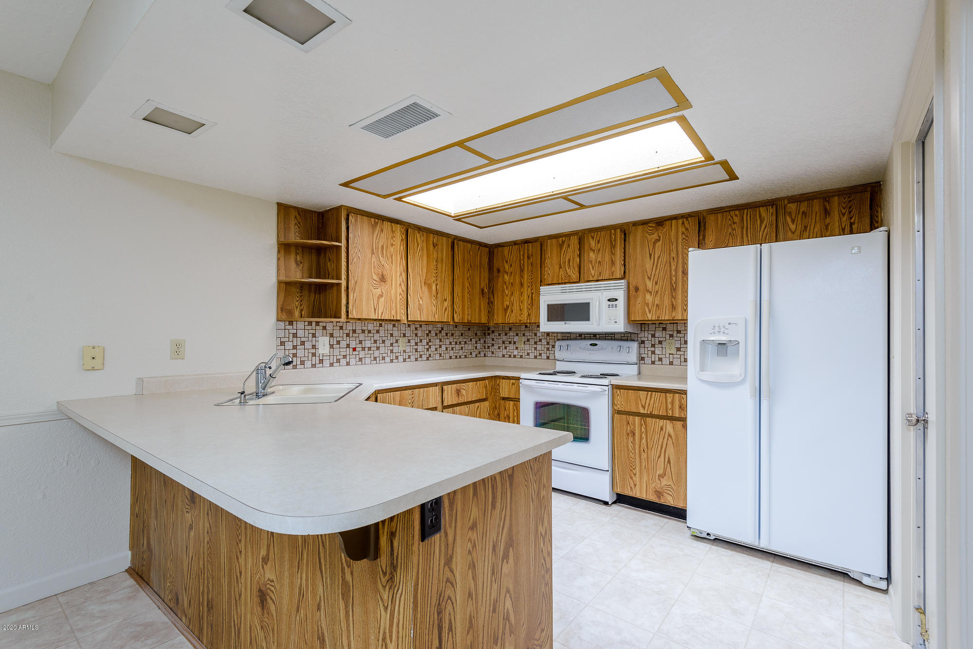 2539 East Wagoner Road Phoenix, AZ 85032 - Photo 5 of 26 Skylight in your pretty kitchen!