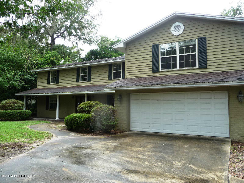 3049 Front Road Jacksonville, FL 32257 - Photo 26 of 30 a front view of a house with a garden