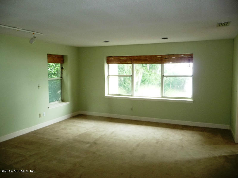 3049 Front Road Jacksonville, FL 32257 - Photo 4 of 30 a view of an empty room with a window