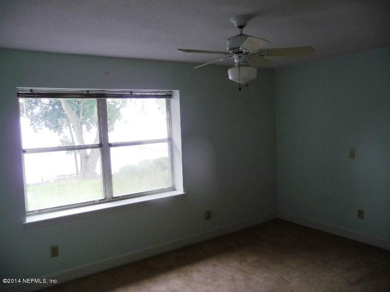 3049 Front Road Jacksonville, FL 32257 - Photo 6 of 30 an empty room with a window