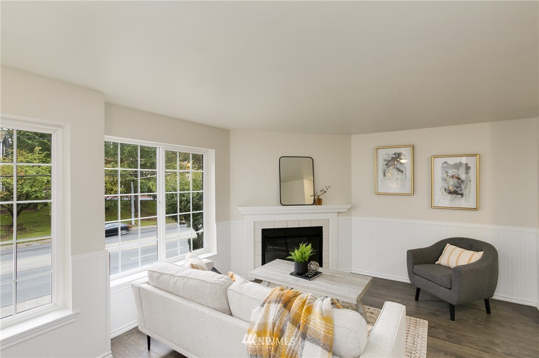 23317 Edmonds Way, Unit 8 Edmonds, WA 98026 - Photo 2 of 26 a living room with furniture and a fireplace