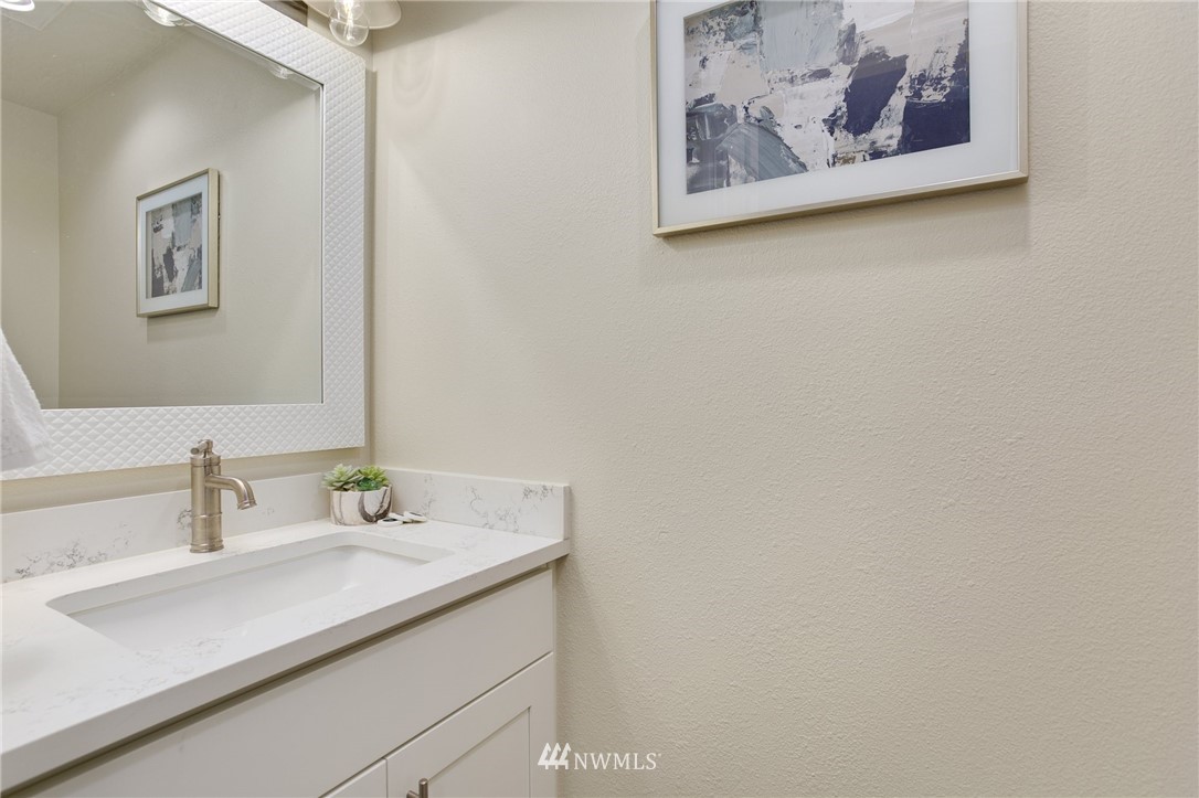 23317 Edmonds Way, Unit 8 Edmonds, WA 98026 - Photo 12 of 26 a bathroom with a sink and a mirror