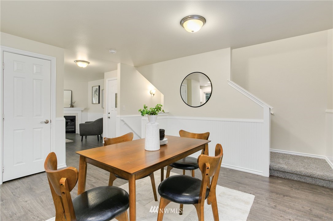 23317 Edmonds Way, Unit 8 Edmonds, WA 98026 - Photo 13 of 26 a view of a dining room with furniture and wooden floor