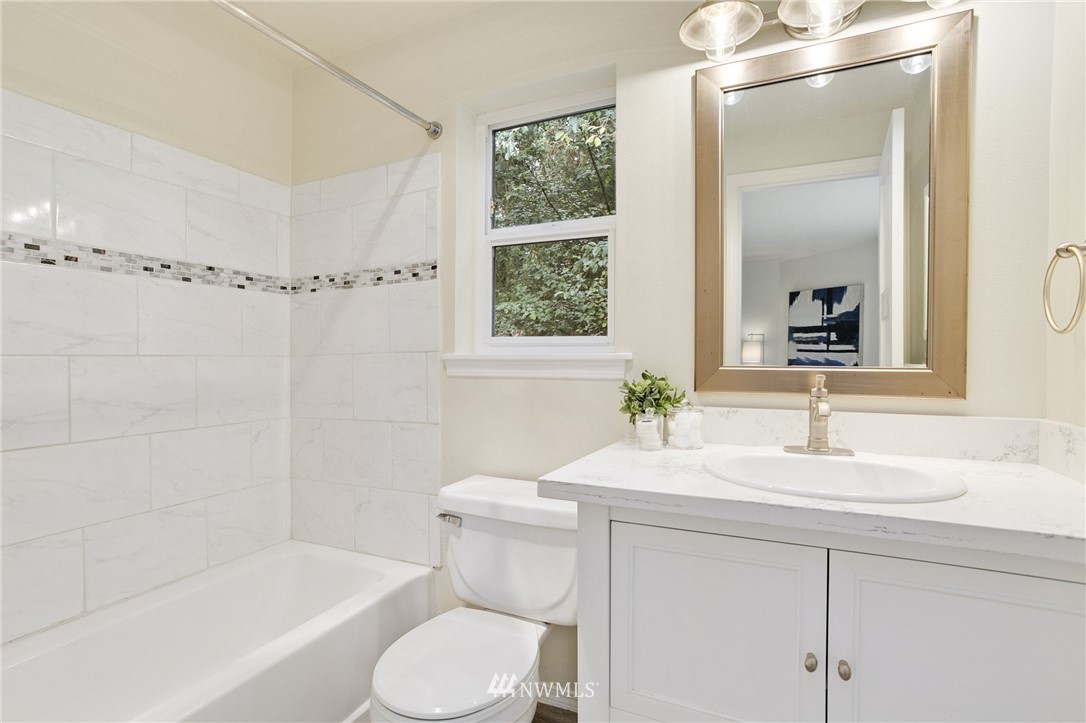 23317 Edmonds Way, Unit 8 Edmonds, WA 98026 - Photo 15 of 26 a bathroom with a sink toilet and shower