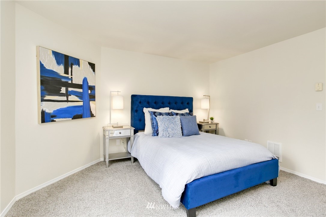 23317 Edmonds Way, Unit 8 Edmonds, WA 98026 - Photo 16 of 26 a bedroom with a bed and dresser