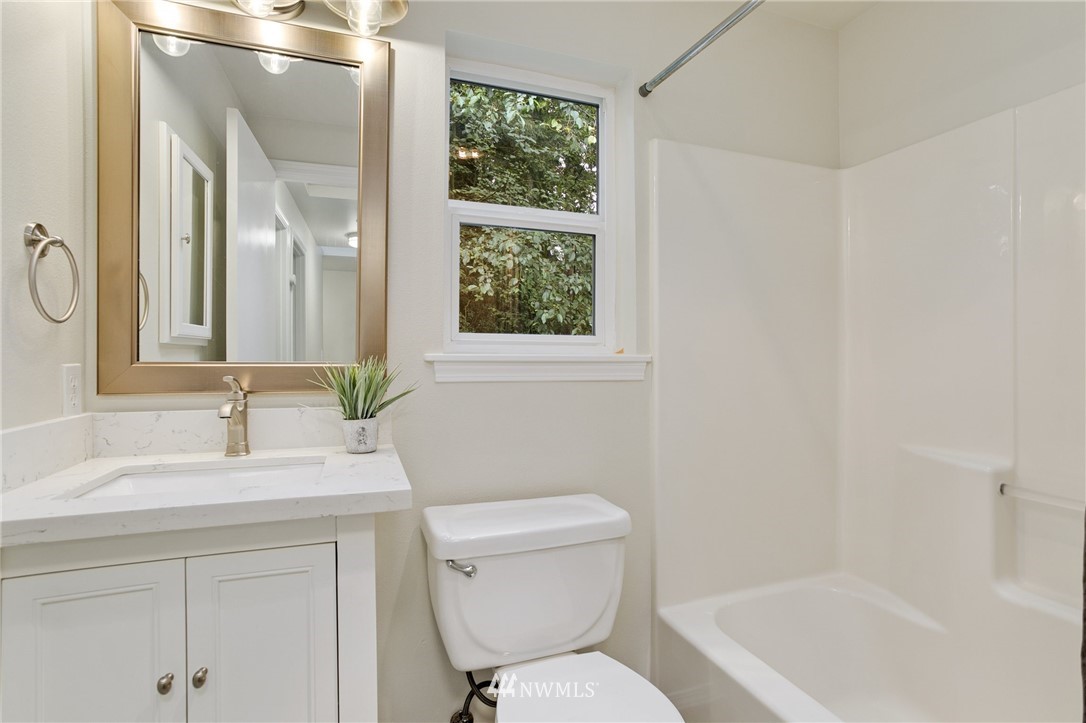 23317 Edmonds Way, Unit 8 Edmonds, WA 98026 - Photo 18 of 26 a bathroom with a sink toilet and shower