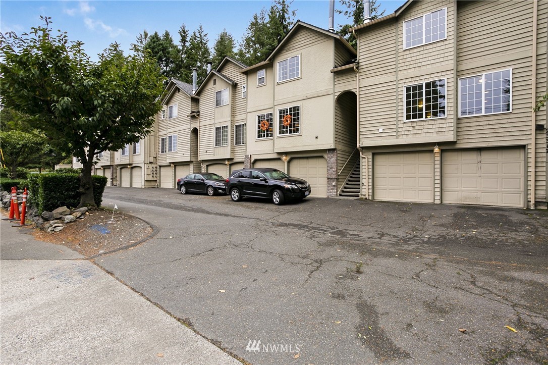 23317 Edmonds Way, Unit 8 Edmonds, WA 98026 - Photo 24 of 26 a car parked in front of white house