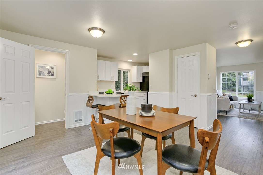 23317 Edmonds Way, Unit 8 Edmonds, WA 98026 - Photo 4 of 26 a view of a dining room with furniture and wooden floor