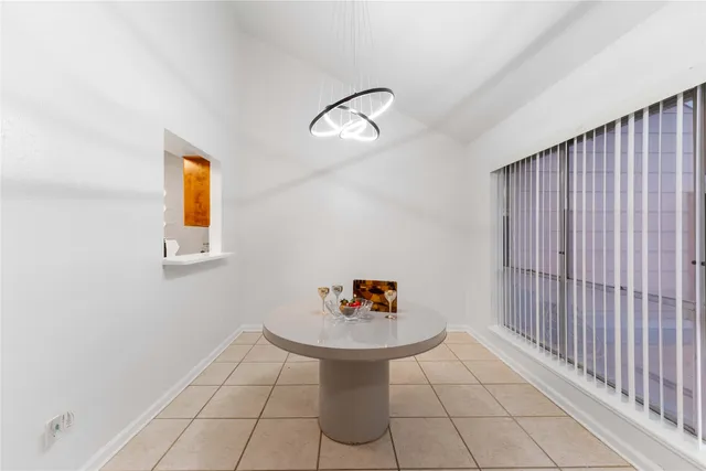 a living room with a sink and chandelier