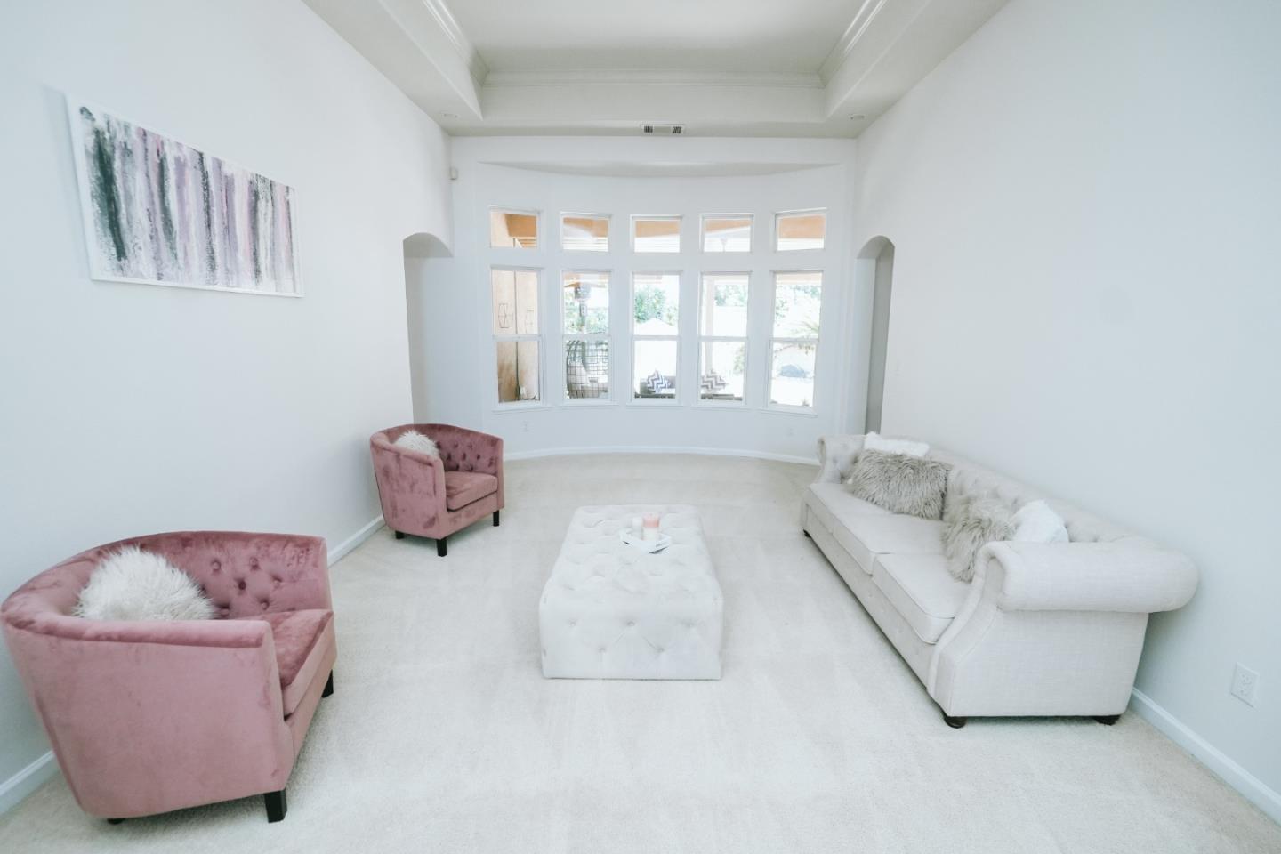 4609 Vía Fiori Modesto, CA 95357 - Photo 11 of 44 a living room with furniture and a large window