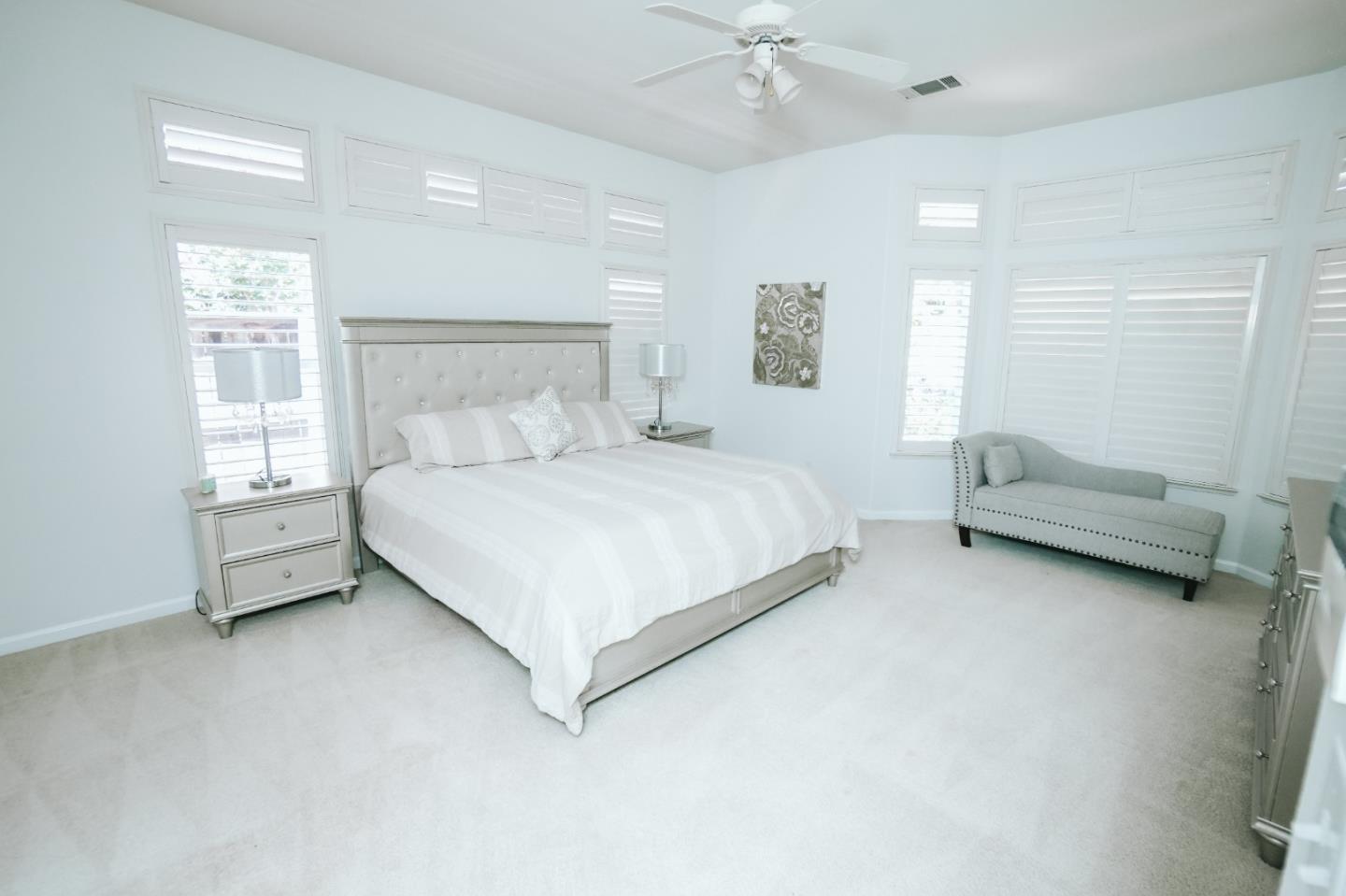 4609 Vía Fiori Modesto, CA 95357 - Photo 18 of 44 a bedroom with a bed and a window