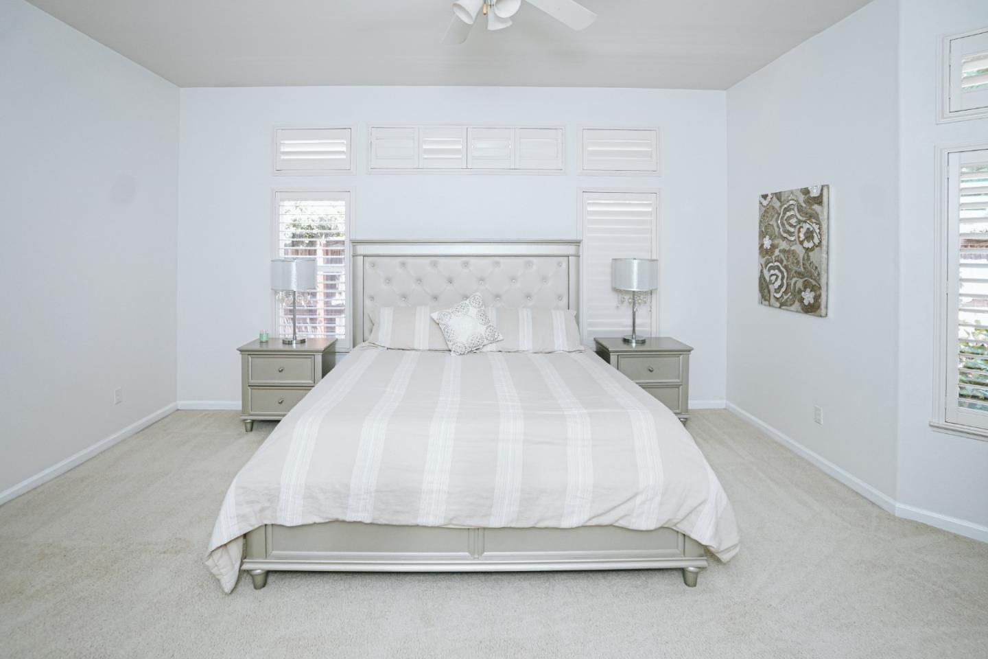 4609 Vía Fiori Modesto, CA 95357 - Photo 20 of 44 a bedroom with a bed and a window