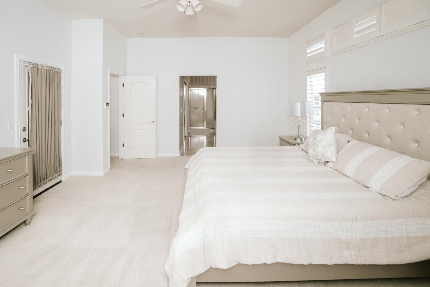 4609 Vía Fiori Modesto, CA 95357 - Photo 21 of 44 a large white bed in a white room