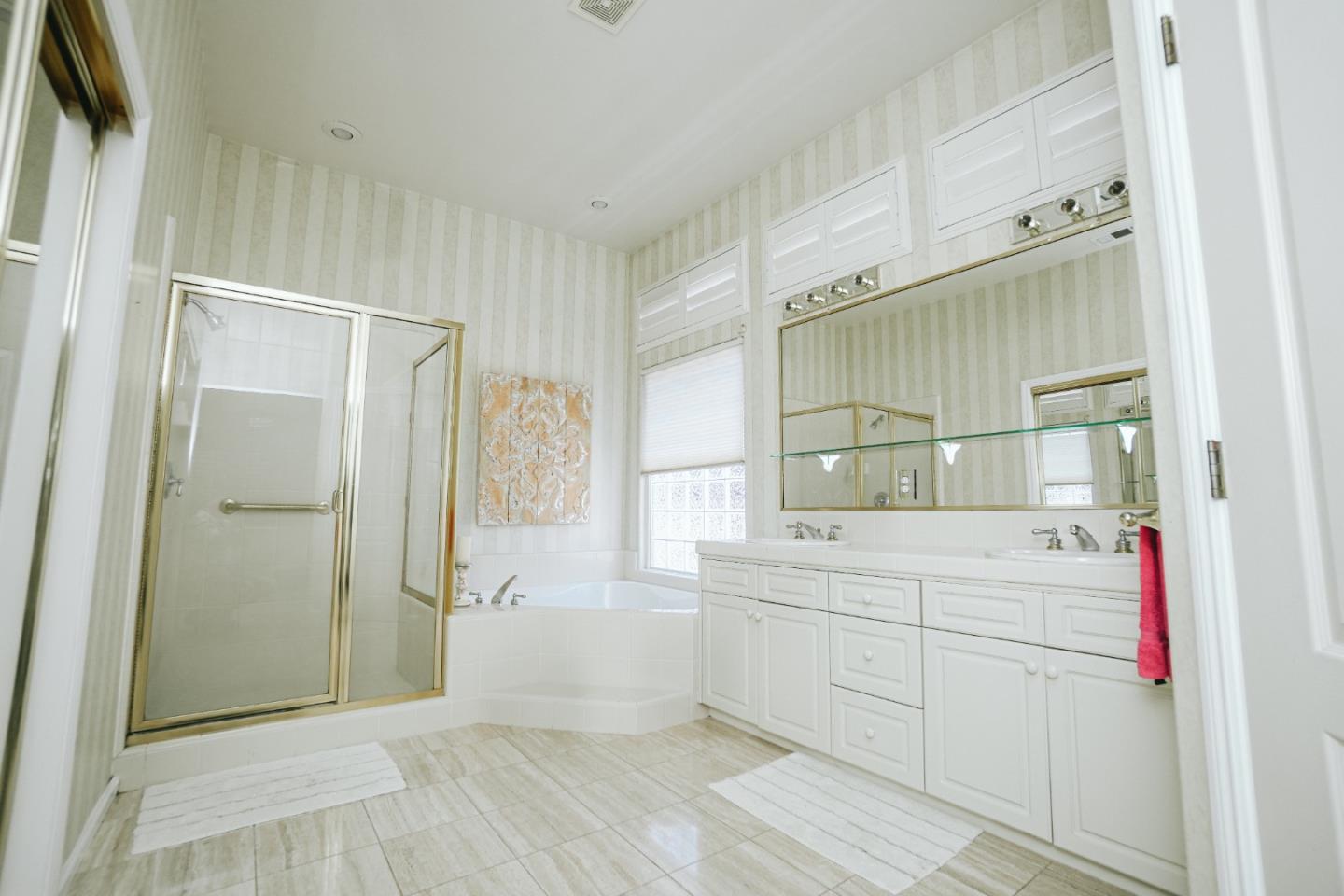 4609 Vía Fiori Modesto, CA 95357 - Photo 23 of 44 a bathroom with a sink mirror and a shower