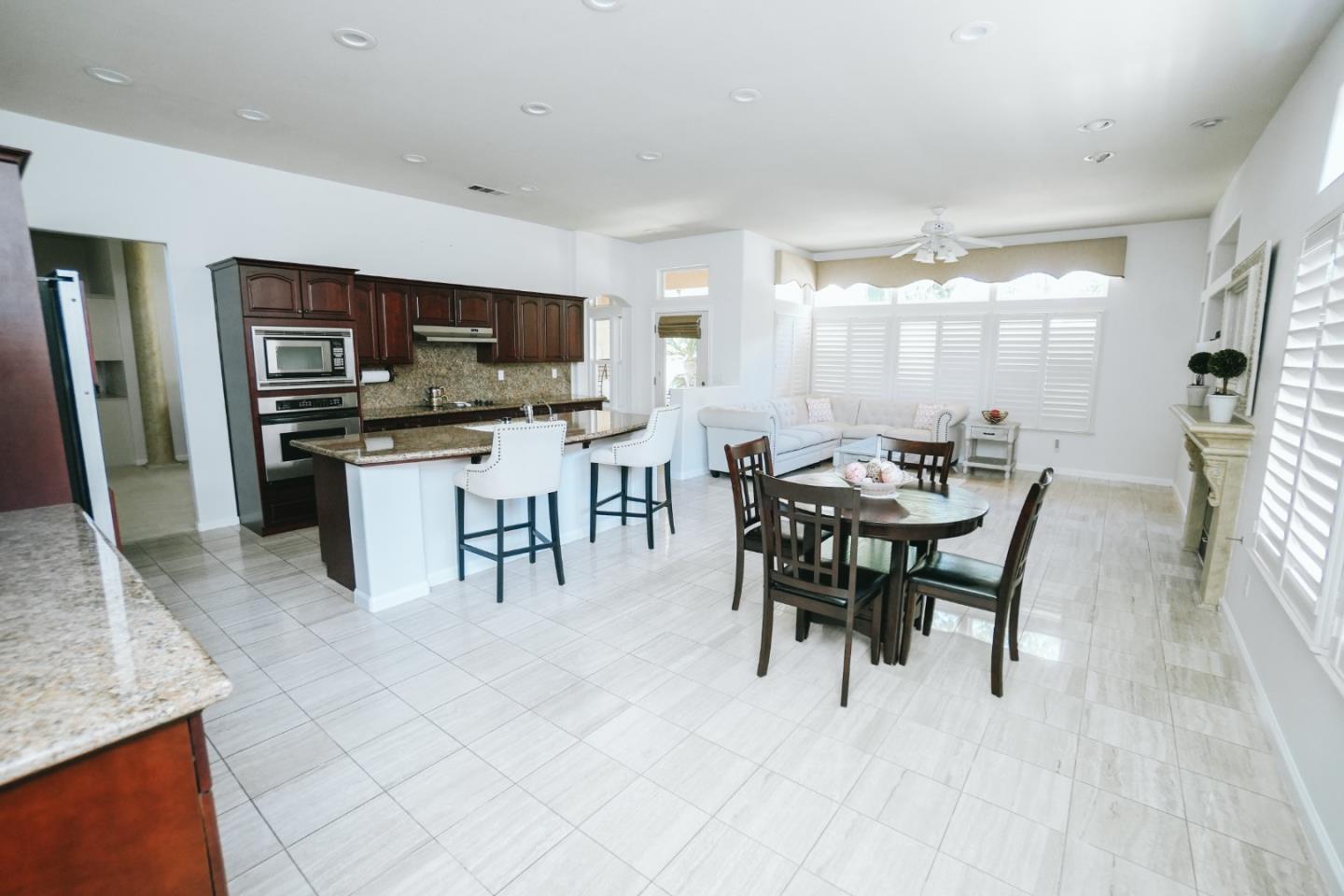 4609 Vía Fiori Modesto, CA 95357 - Photo 29 of 44 a view of a dining room with furniture