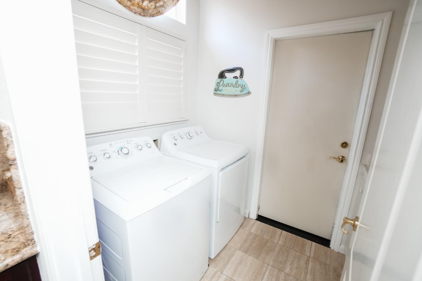 4609 Vía Fiori Modesto, CA 95357 - Photo 37 of 44 a utility room with dryer and washer