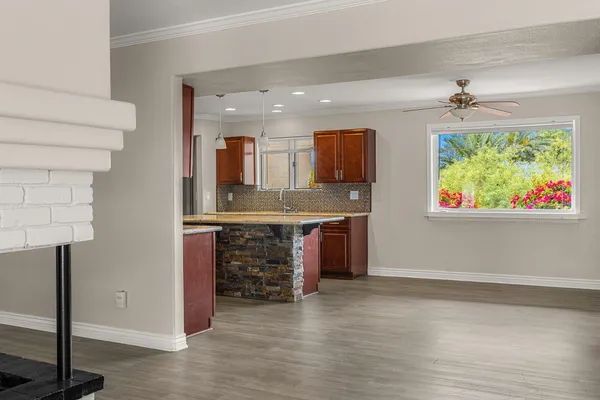 a view of kitchen with furniture and window