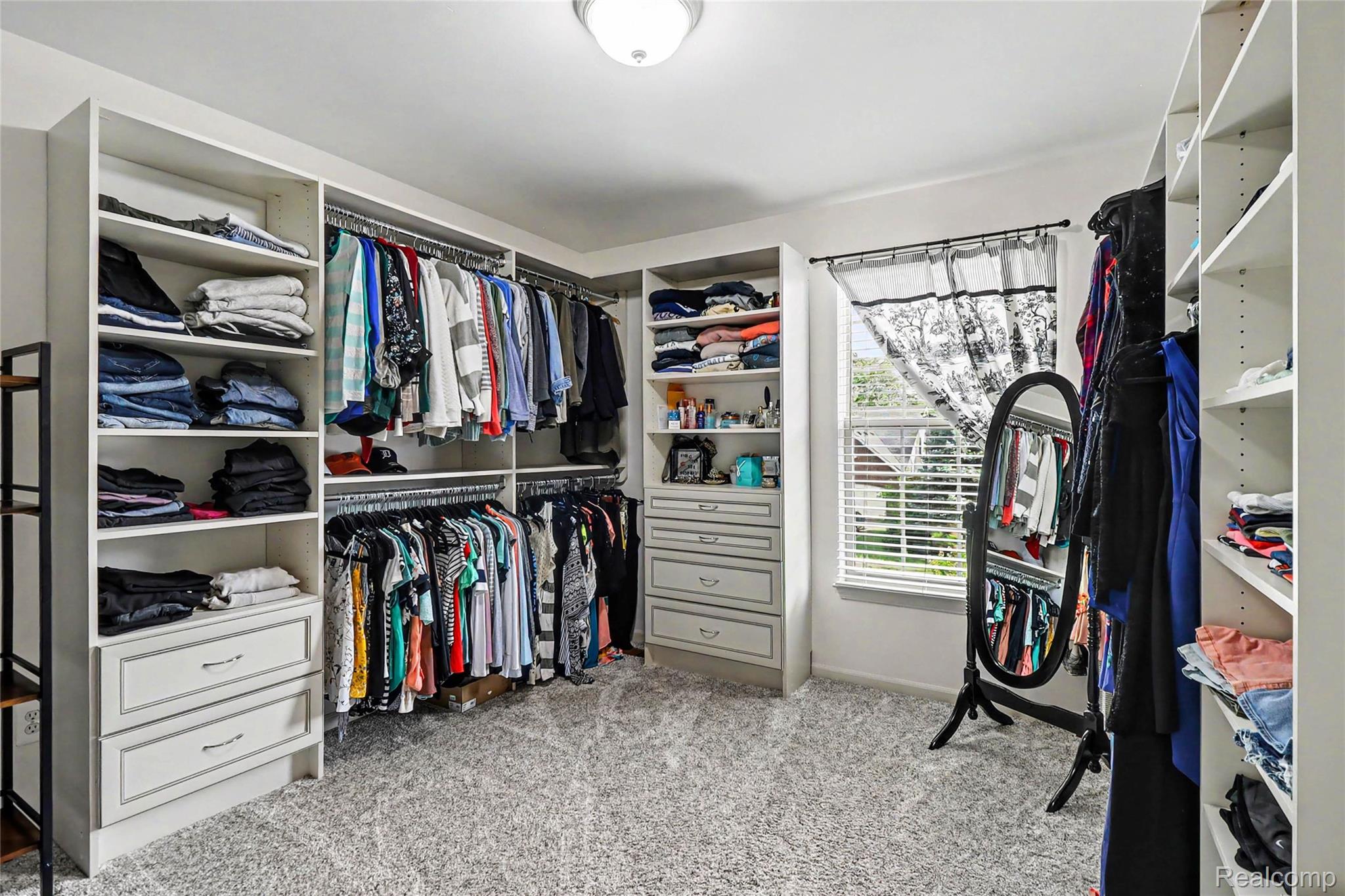 2548 Empire Court Rochester, MI 48309 - Photo 29 of 40 Custom closet system with built-in shelving, multiple hanging rods, and integrated drawers
