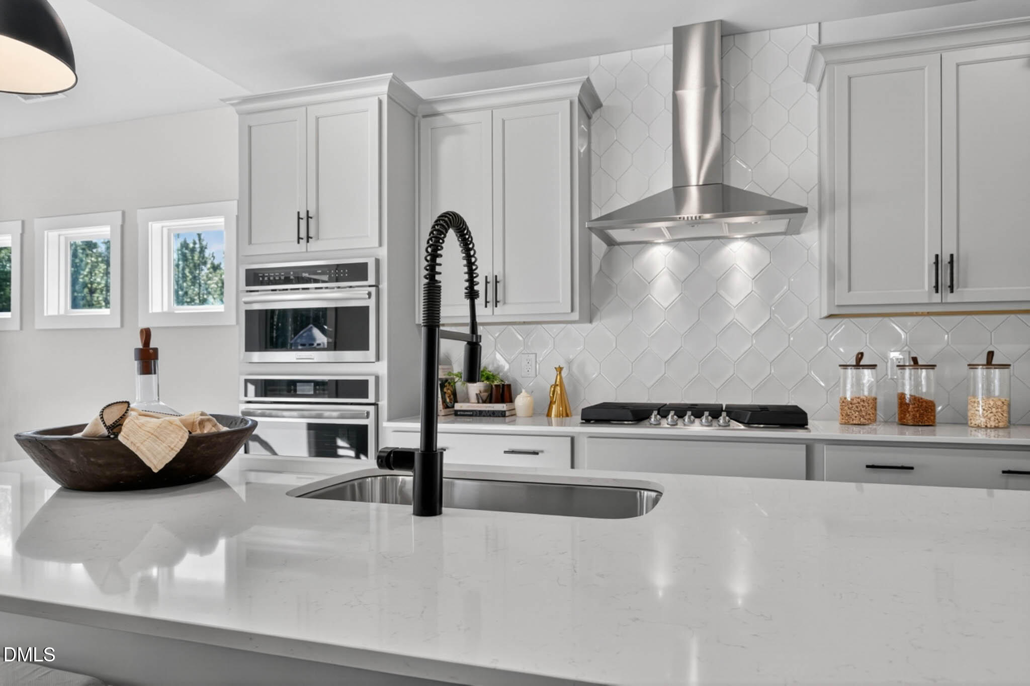 778 Beacon Hl Road Lillington, NC 27546 - Photo 15 of 44 a kitchen with stainless steel appliances granite countertop a sink dishwasher stove and white cabinets with wooden floor