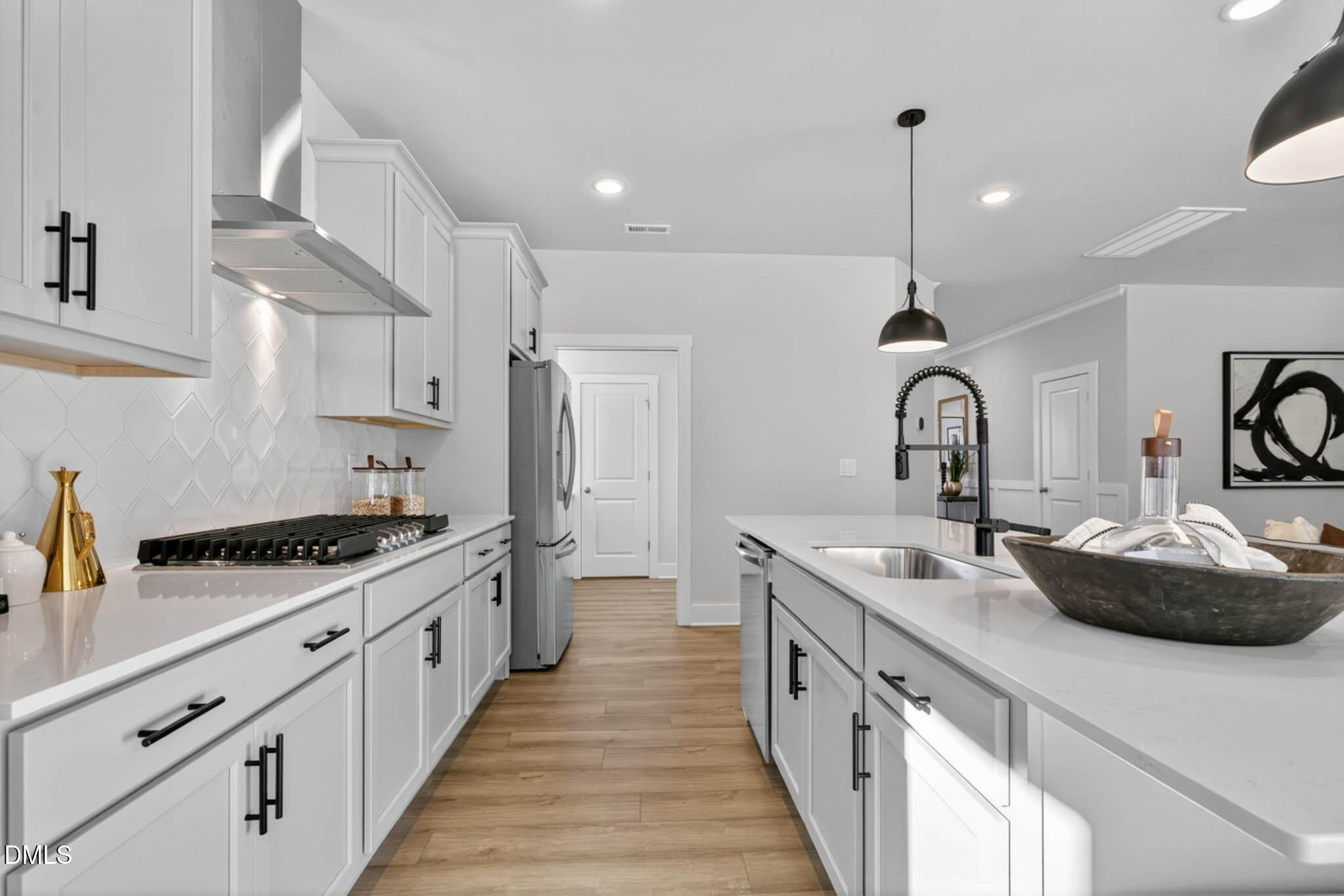 778 Beacon Hl Road Lillington, NC 27546 - Photo 16 of 44 a kitchen with stainless steel appliances a sink stove and cabinets
